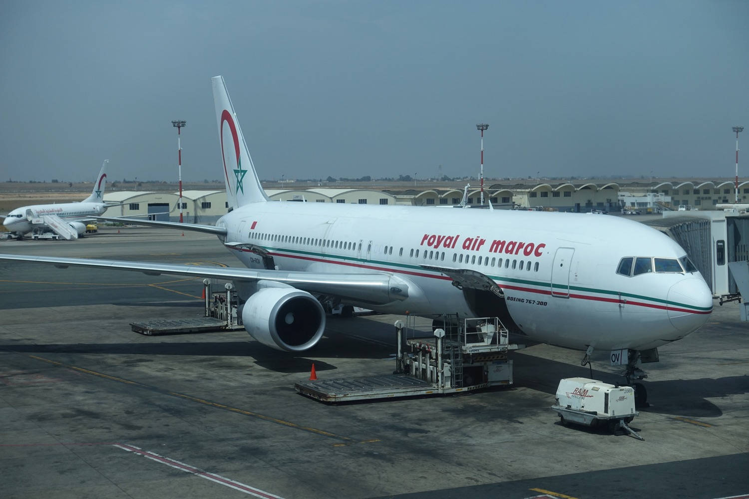 Royal Air Maroc Airplane With Cargo Vehicle Wallpaper