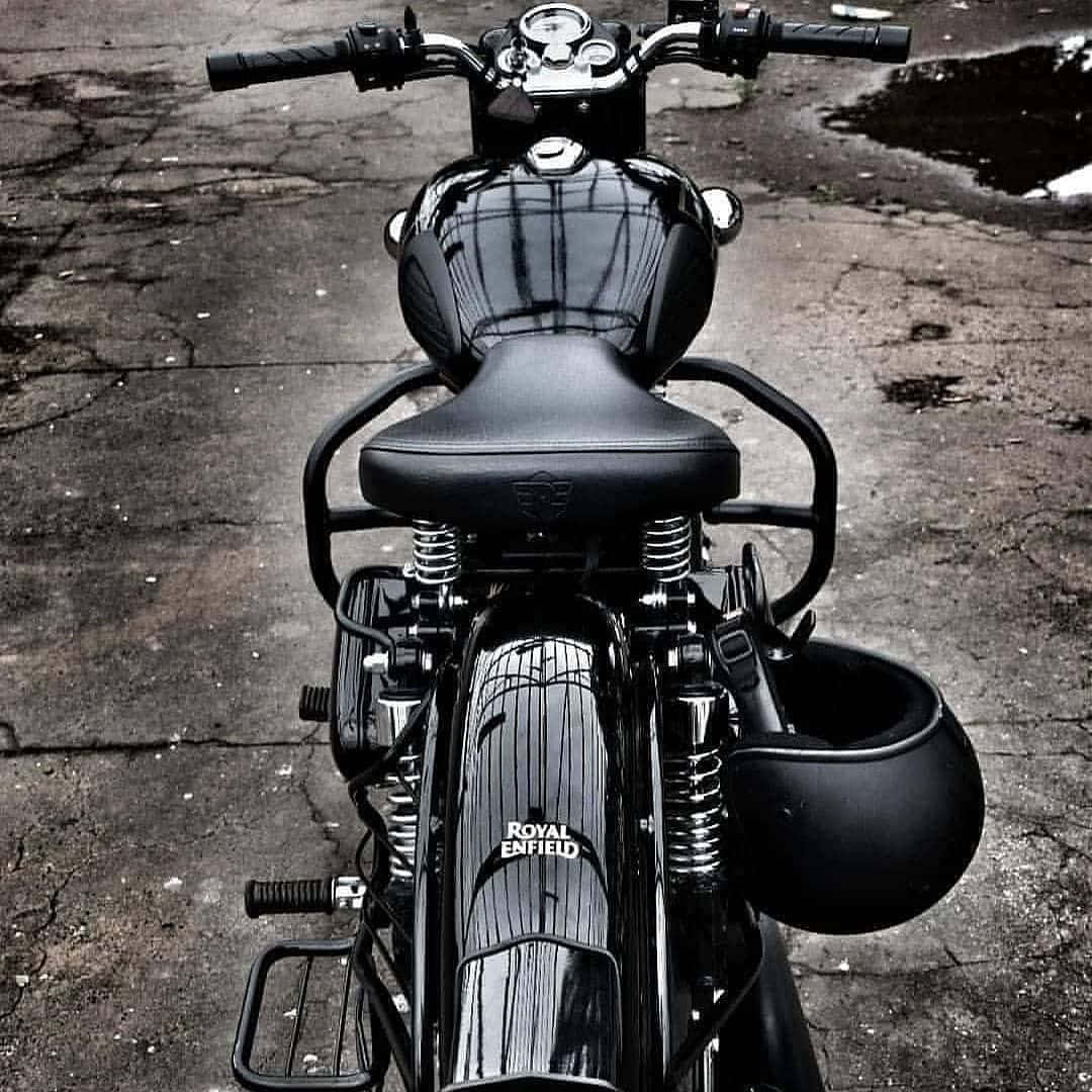 A Black Motorcycle Parked On A Street