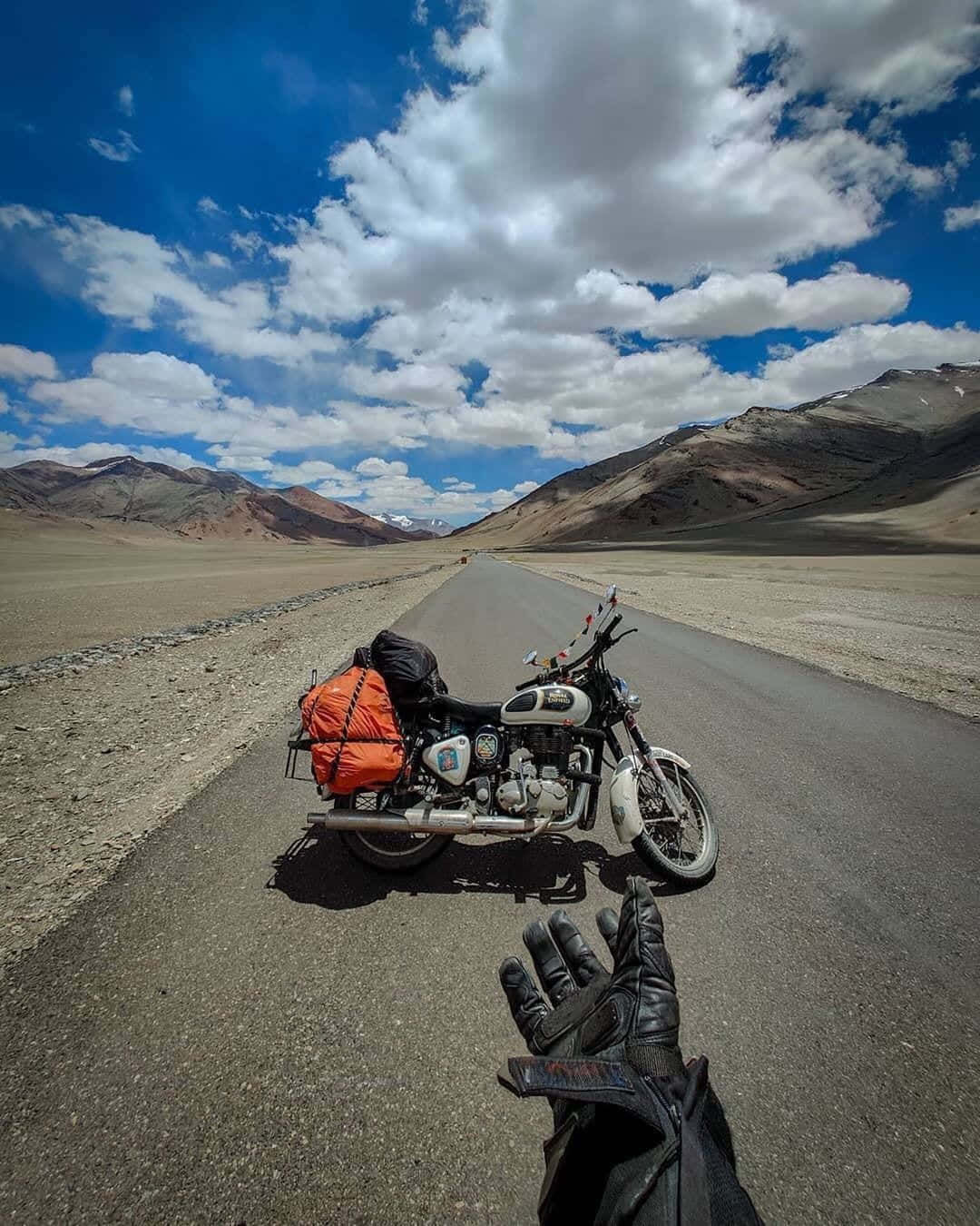A Motorcycle Is Parked On A Deserted Road