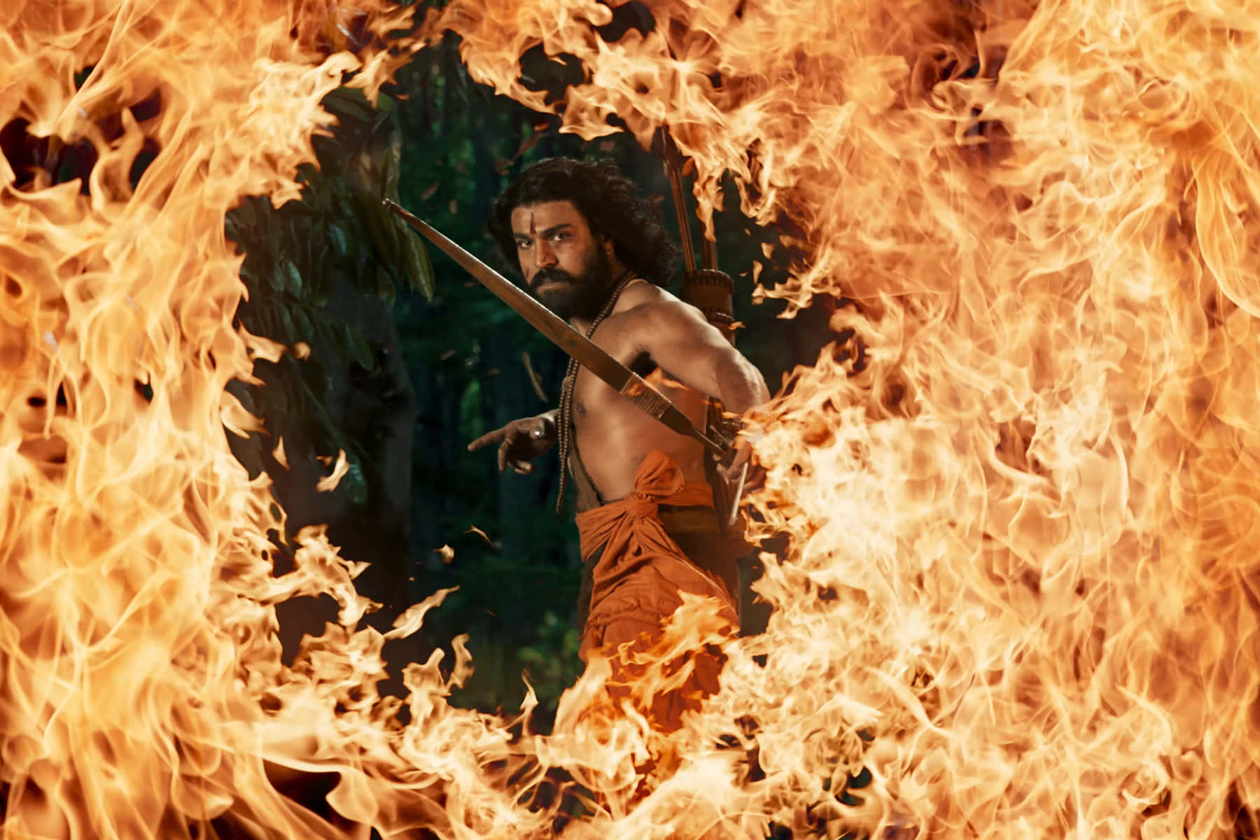 A Man In A Fire Scene With A Sword