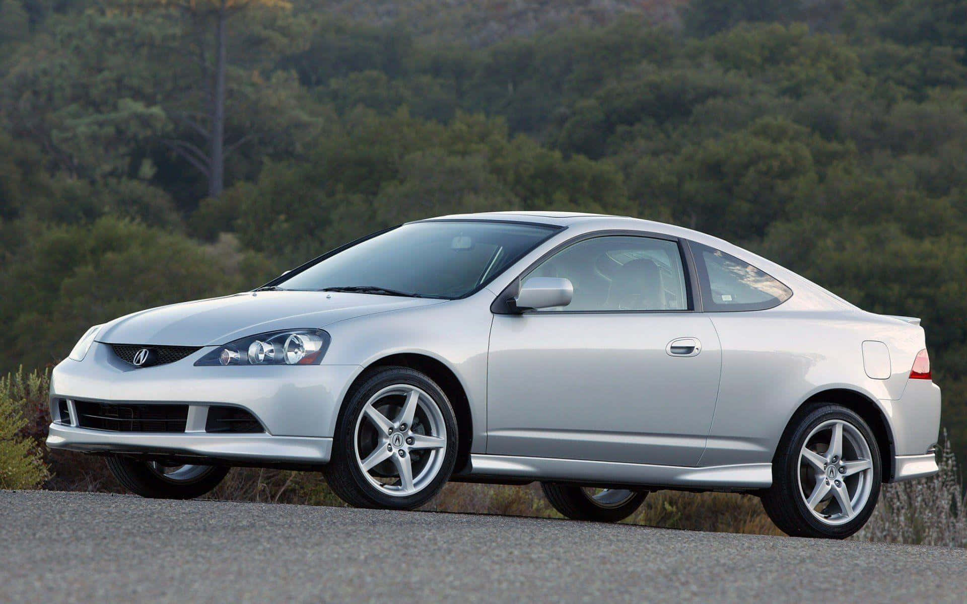 Sleek Acura RSX Type-S parked outdoors Wallpaper