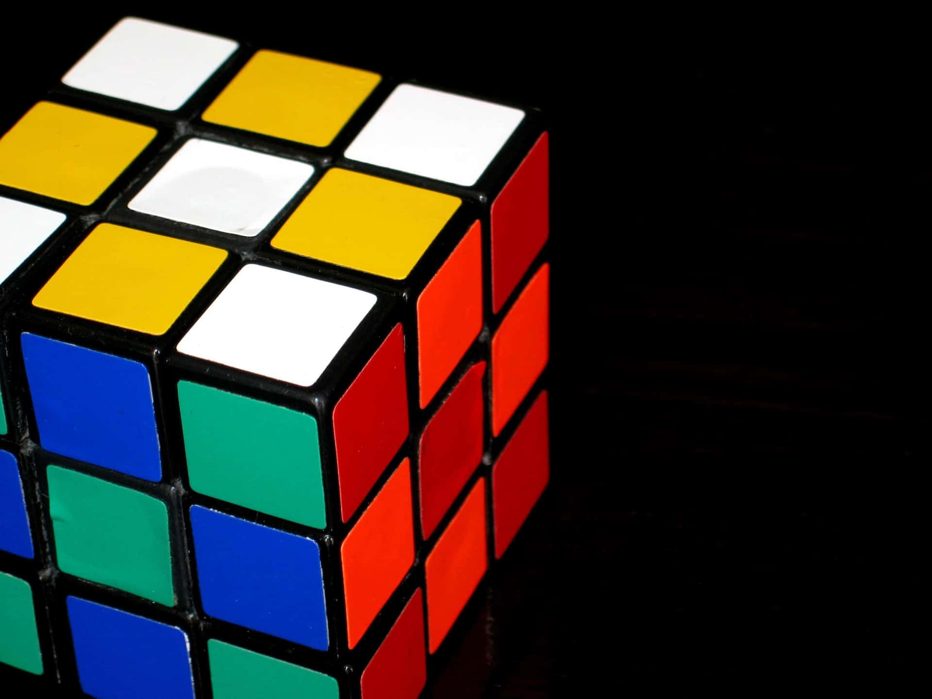 Rubiks Cubeon Black Background Wallpaper