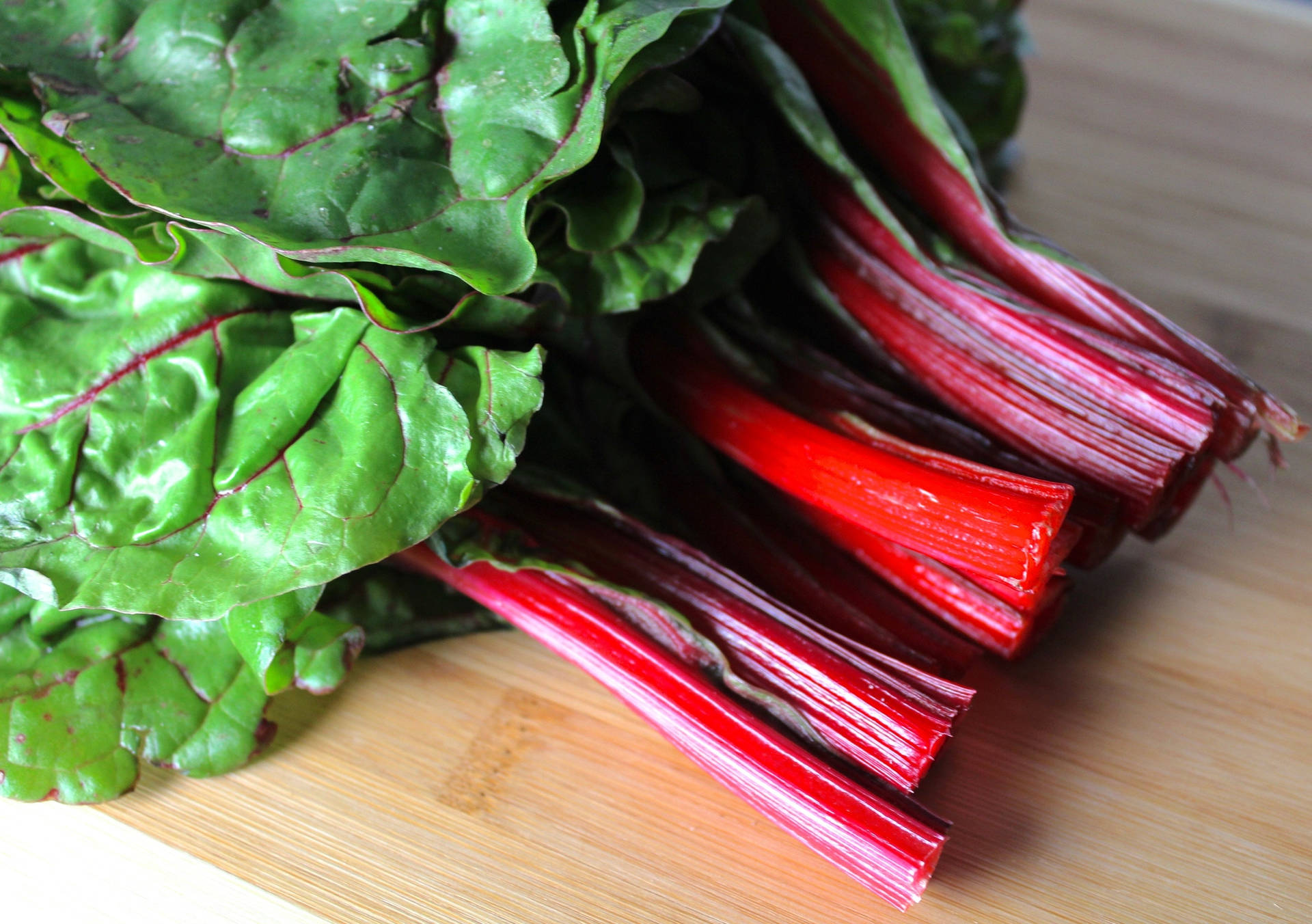 Caption: Fresh Ruby Red Swiss Chard in High Resolution Wallpaper