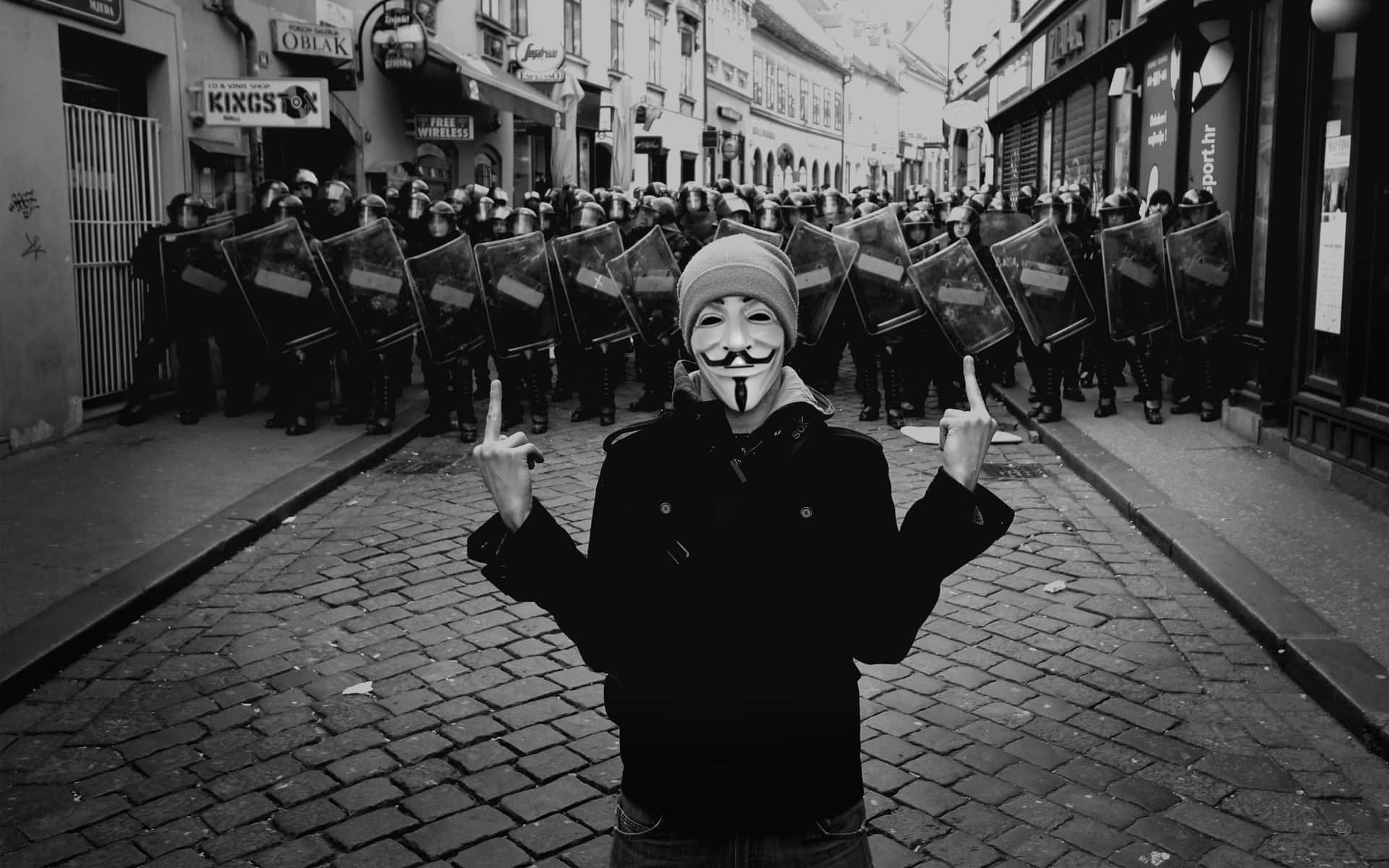 A Man In A Mask Standing In Front Of A Group Of Soldiers Wallpaper
