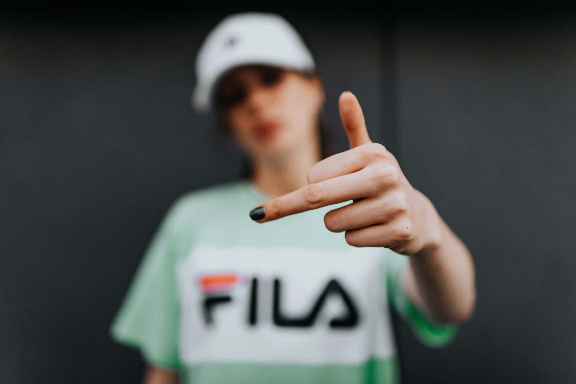 Fila T-shirt - A Woman Showing The Thumbs Up Wallpaper