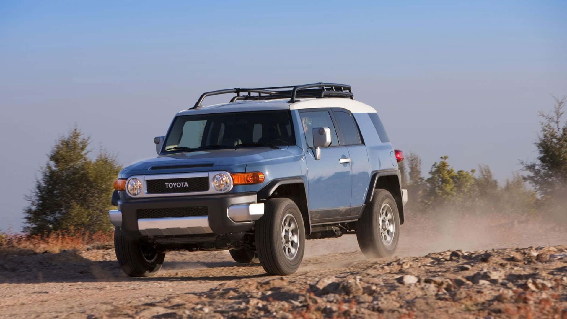 Rugged Off-road Adventure - Toyota Fj Cruiser In Wilderness Wallpaper