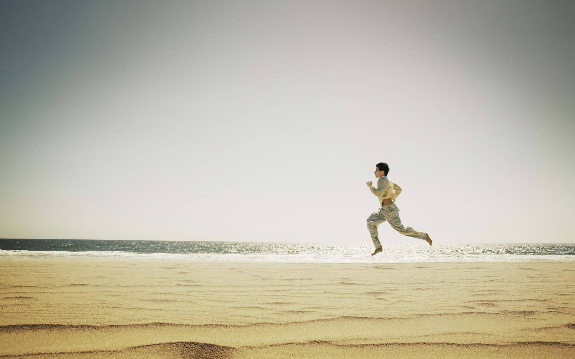 Running Man In Beach Shore Wallpaper