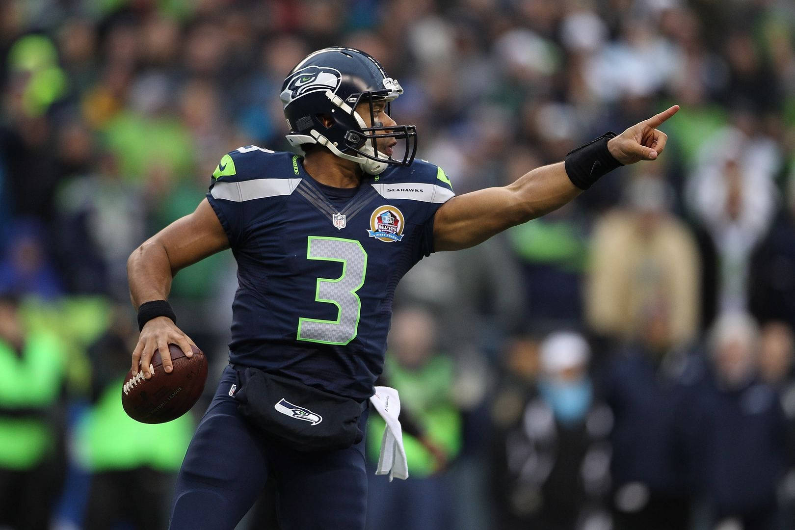 Russel Wilson Pointing During Game Wallpaper