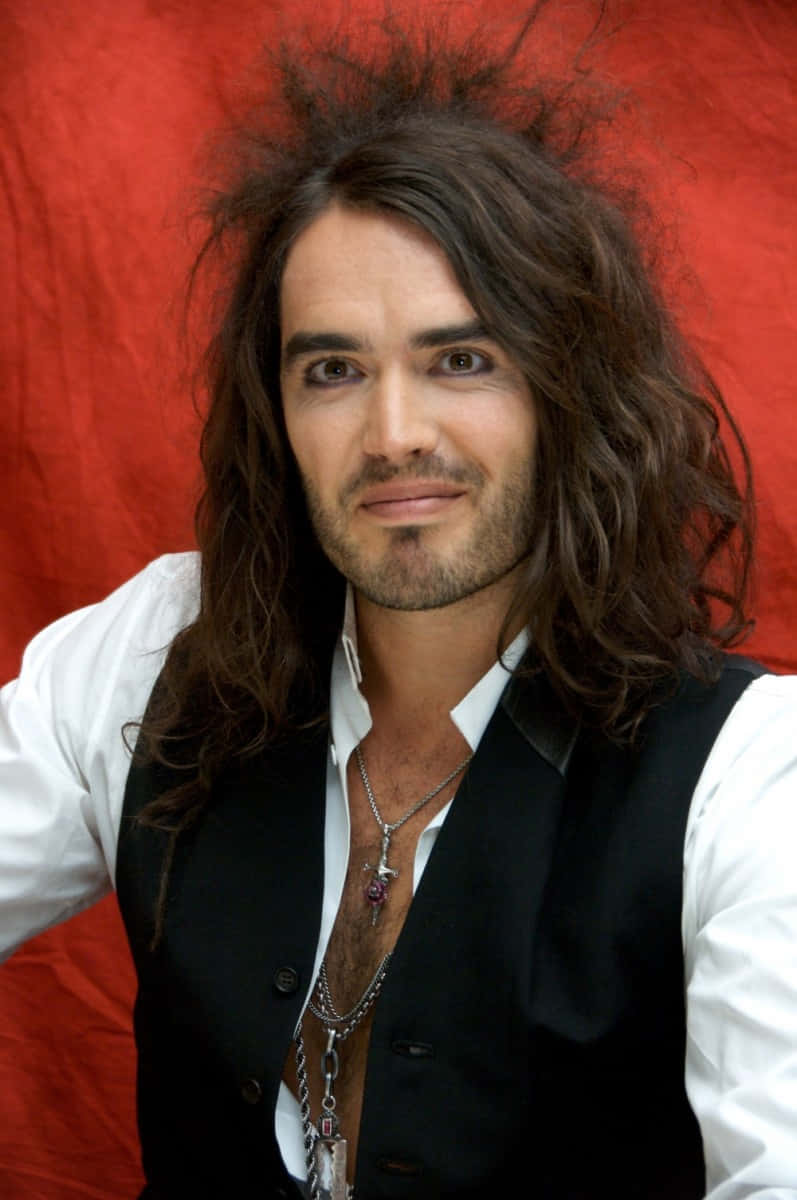 Russell Brand Red Background Photoshoot Wallpaper