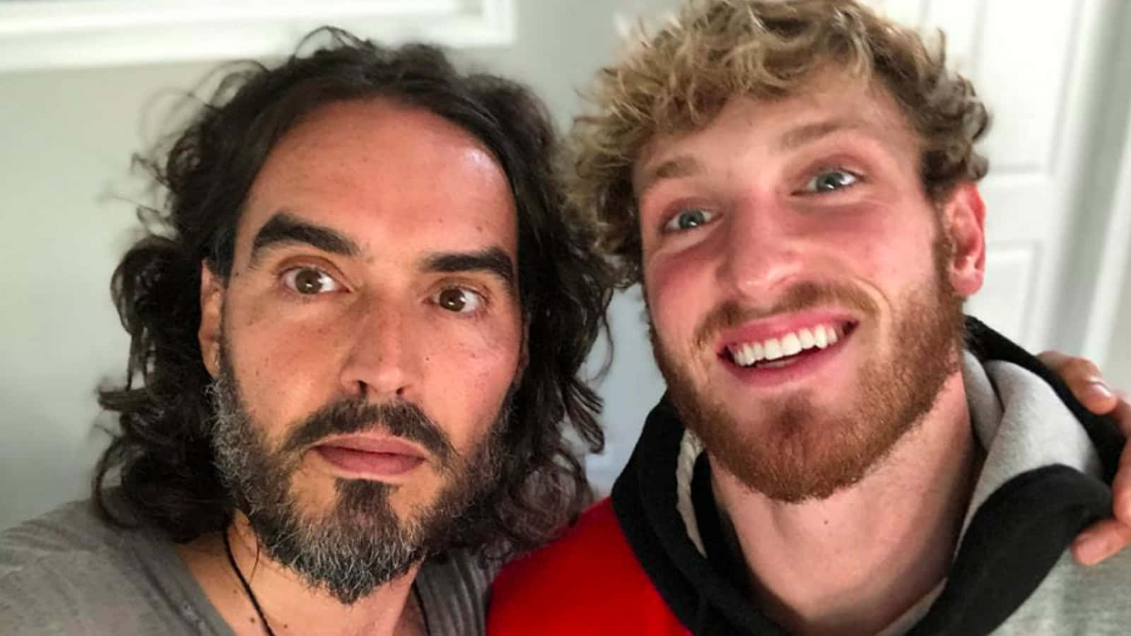 Russell Brand With Logan Paul Wallpaper