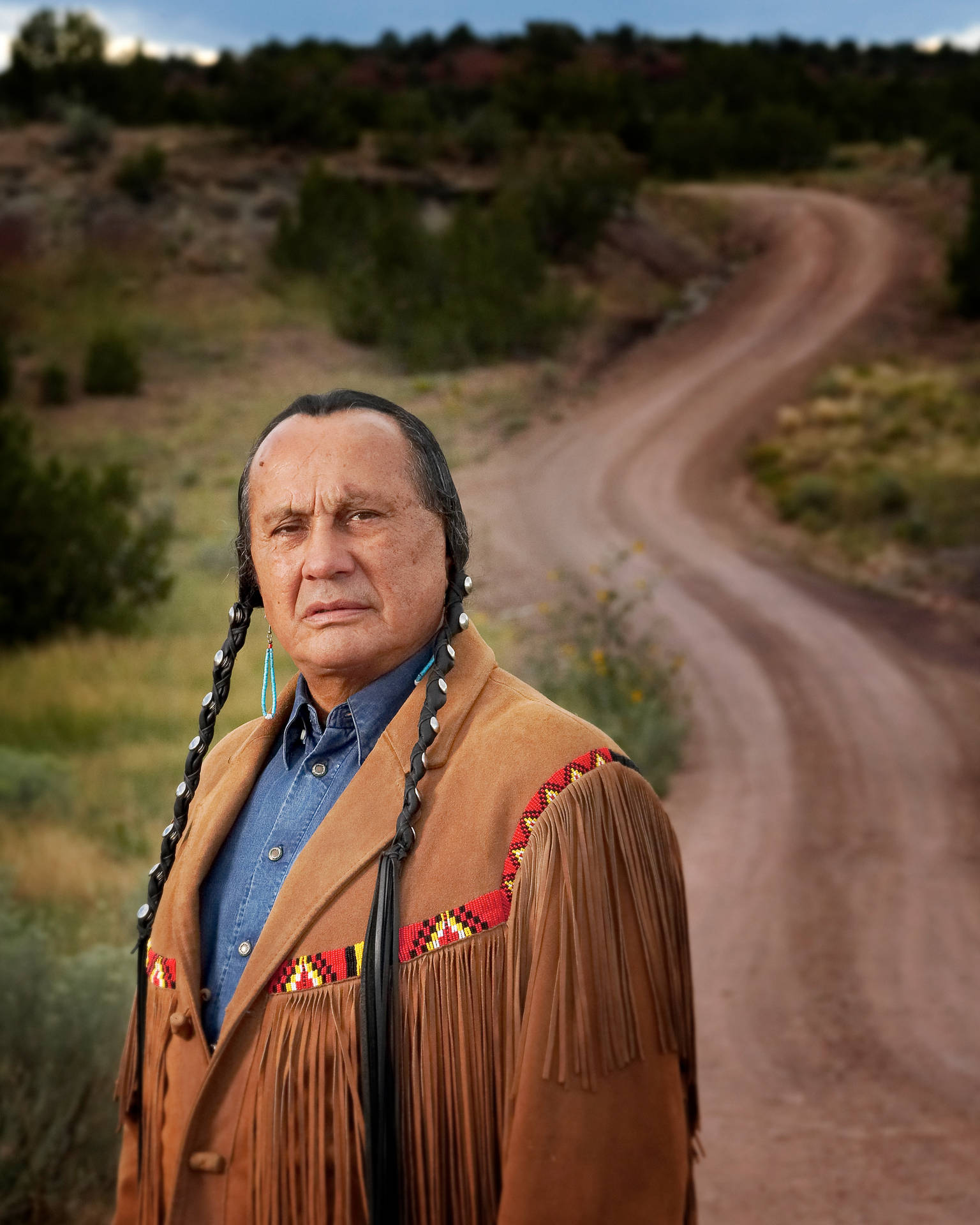 Russell Means: A Portrait of Pride and Strength Wallpaper