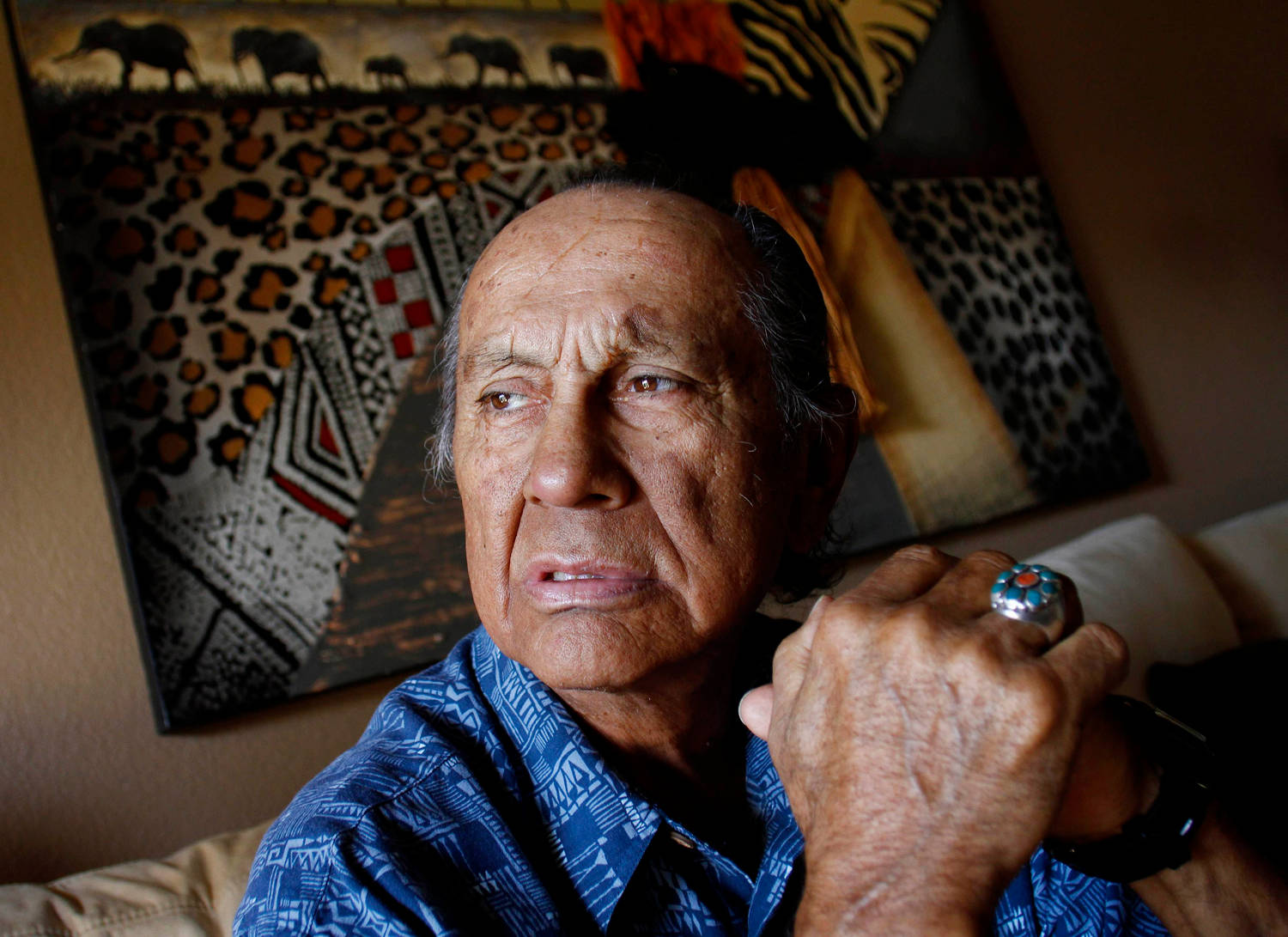 Russell Means, Prominent Native American Activist in Casual Attire Wallpaper