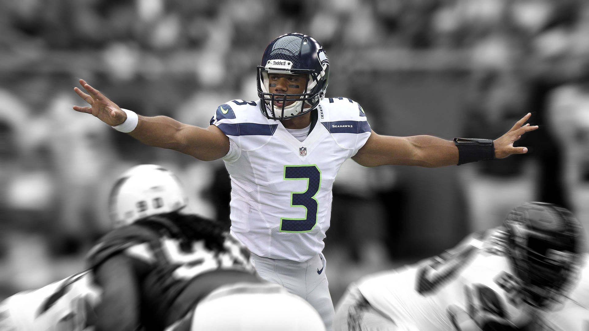 Russell Wilson Holding Hands Up Black And White Wallpaper