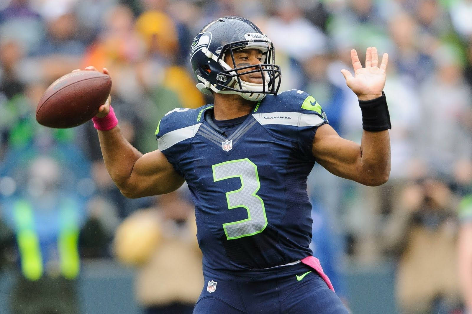 Russell Wilson In Ball Throwing Position Wallpaper
