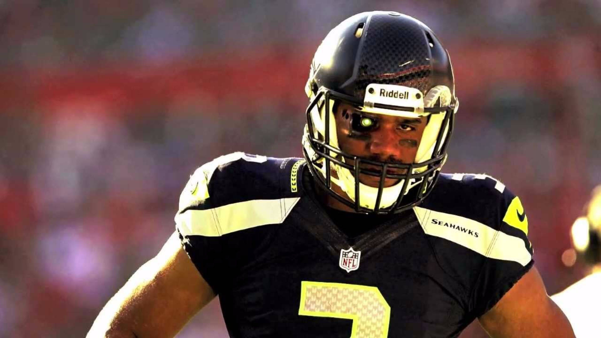 American Football Star Russell Wilson Poised in Helmet Wallpaper