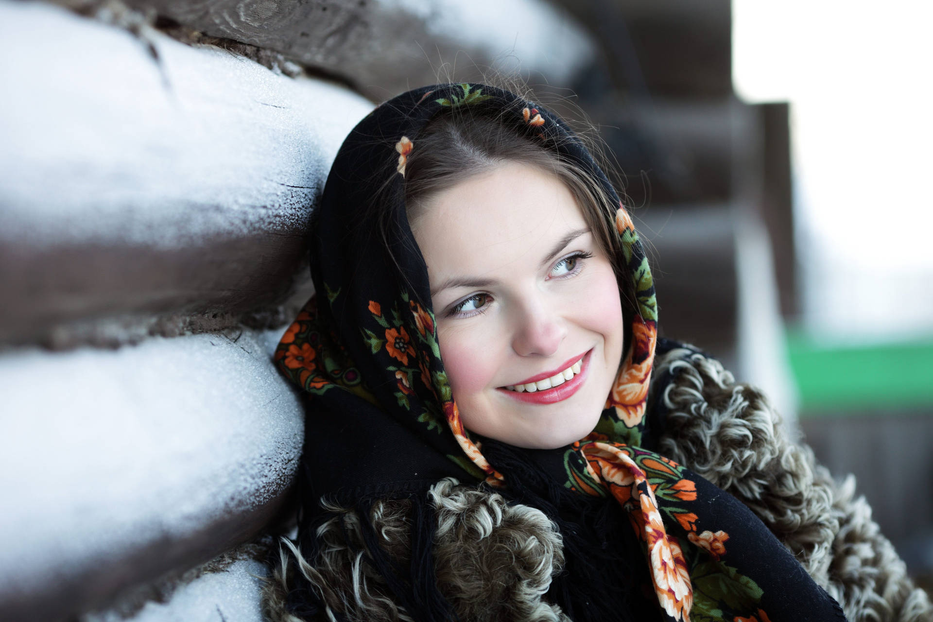 Russian Girl Leaning Against Snowy Wall Wallpaper