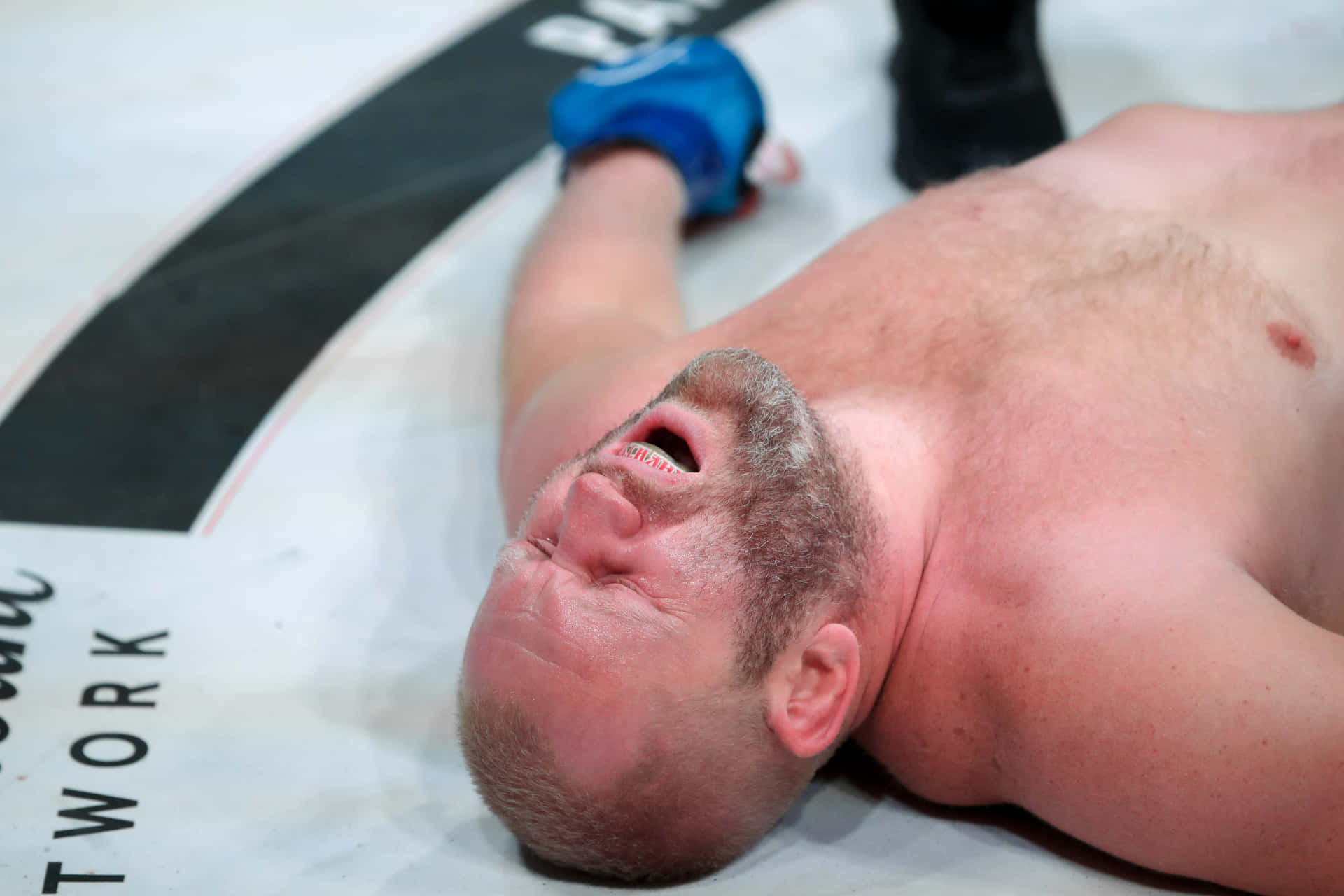 Russian MMA Fighter Sergei Kharitonov In Pain During A Fight Wallpaper