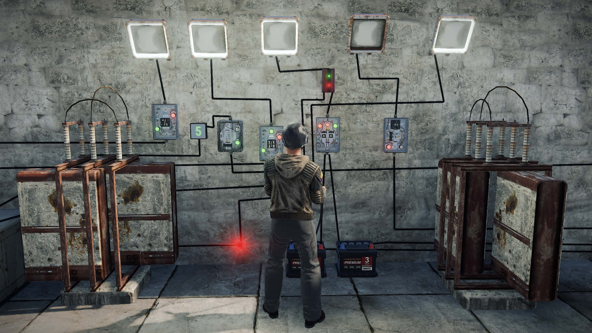 En mand står foran et rum med mange elektriske enheder. Wallpaper