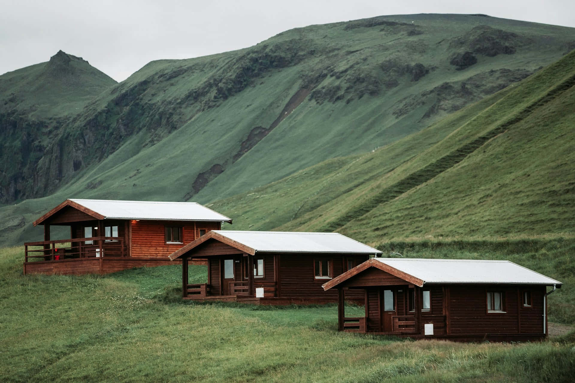 Rustic Cabins Hillside Greenery Wallpaper