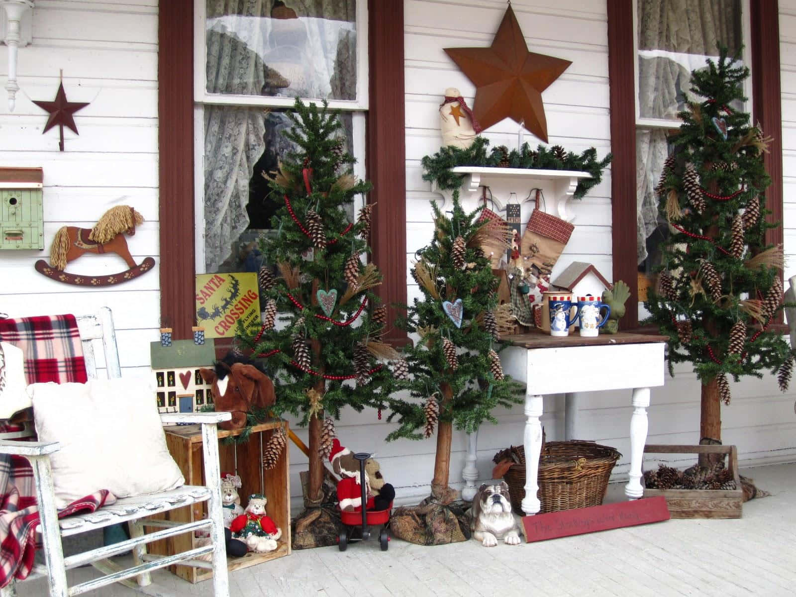 A Porch With Christmas Decorations And A Rocking Chair
