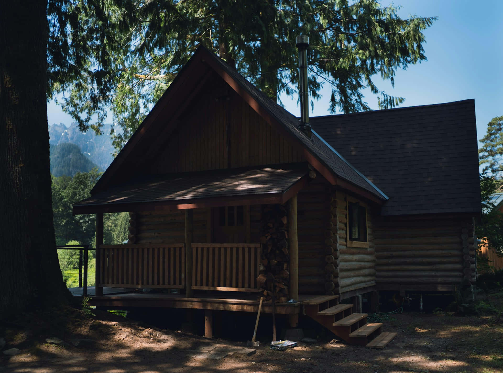 Rustic Log Cabinin Forest Setting Wallpaper