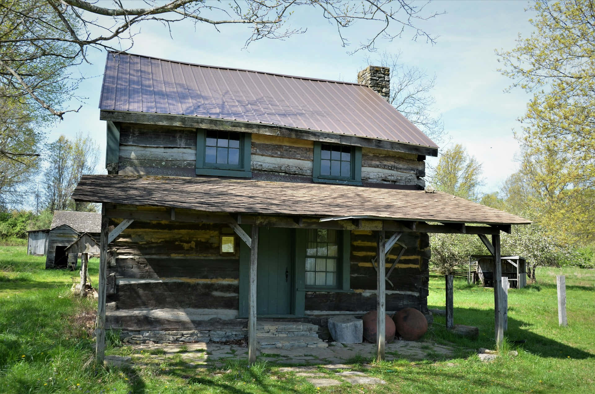 Rustic Log Cabinin Springtime Wallpaper