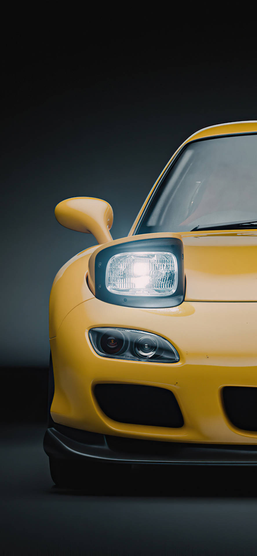 a yellow sports car with a black background Wallpaper