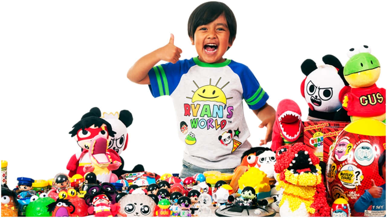 A Young Boy Standing In Front Of A Large Pile Of Stuffed Animals Wallpaper