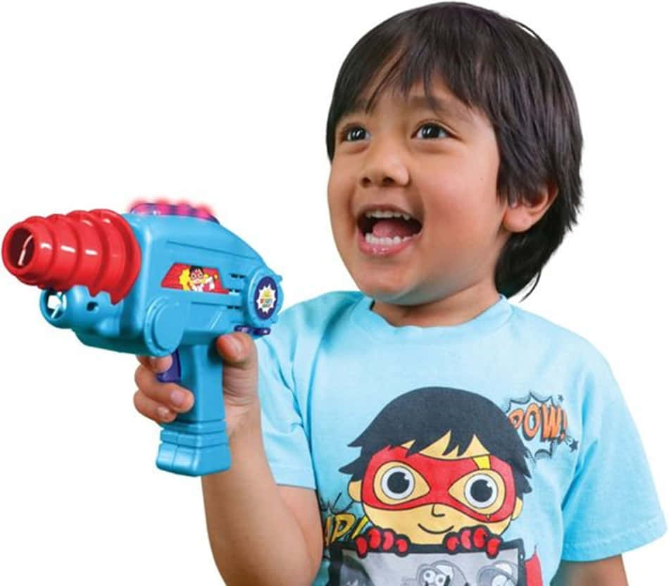 A Young Boy Holding A Toy Gun Wallpaper
