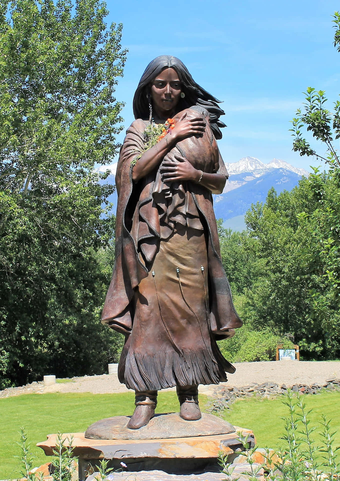 A Statue Of A Woman Holding A Baby