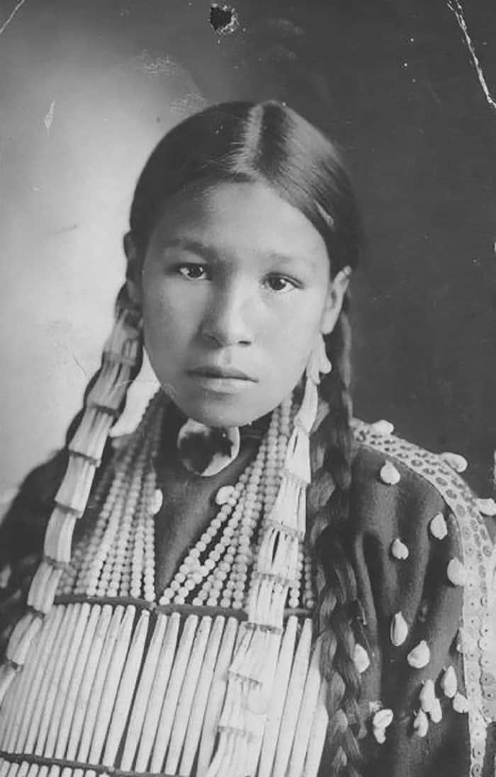 A Young Native American Woman In Traditional Dress