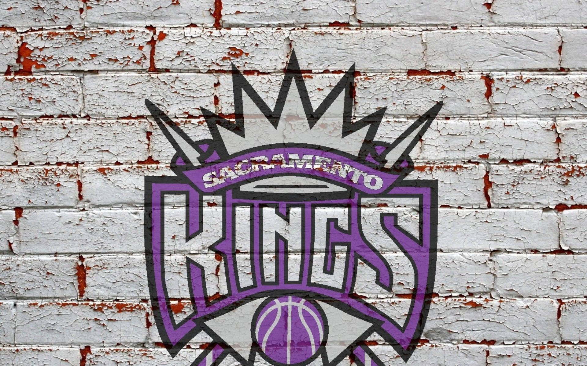 Logode Los Sacramento Kings En Una Pared De Ladrillos Fondo de pantalla
