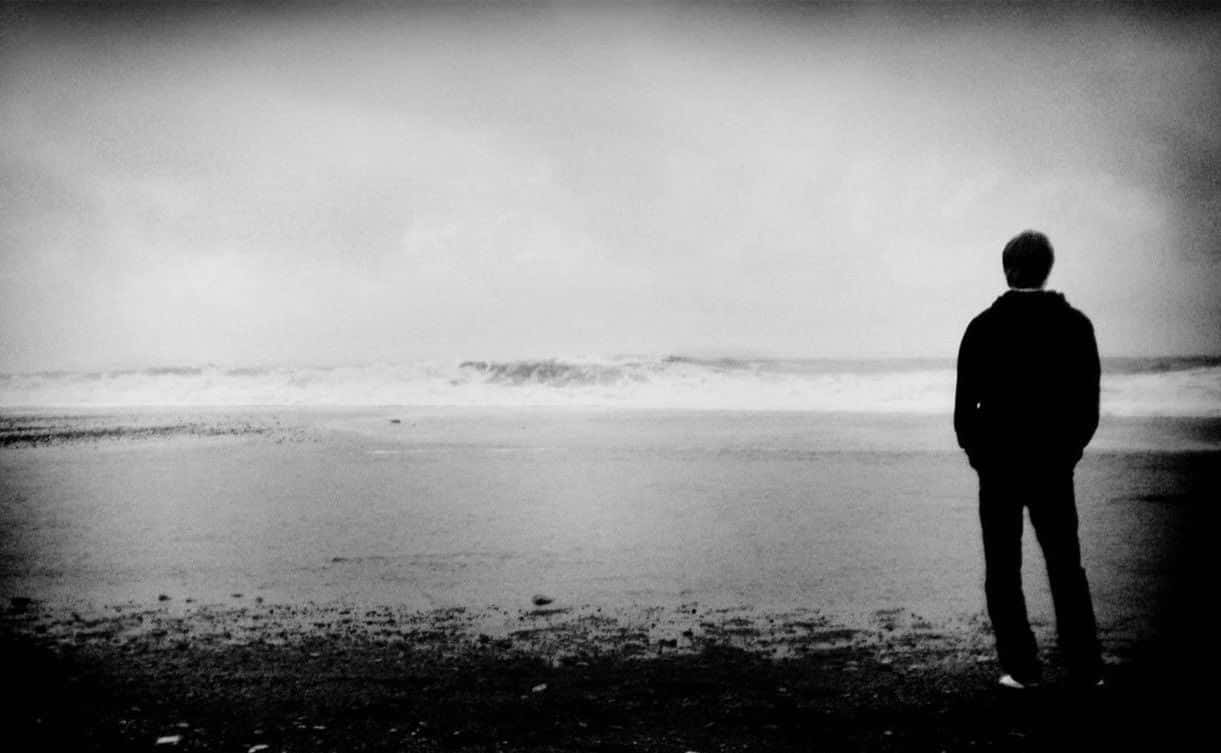 Alone Man On Beach Sad Background