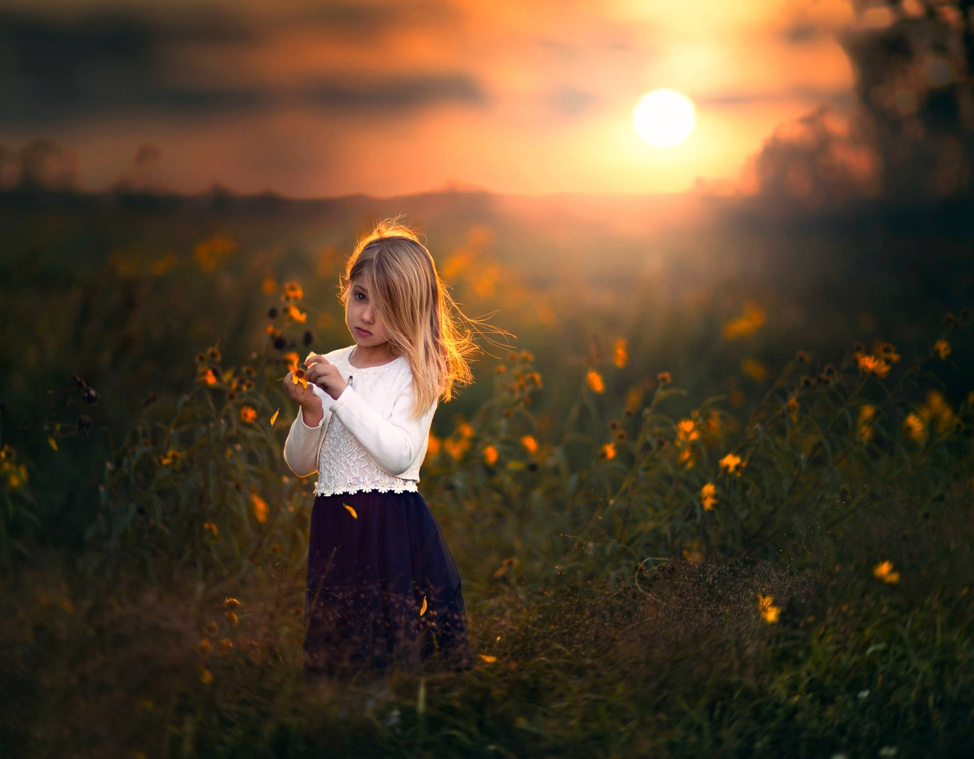 Sad Child And Flowers At Sunset Wallpaper