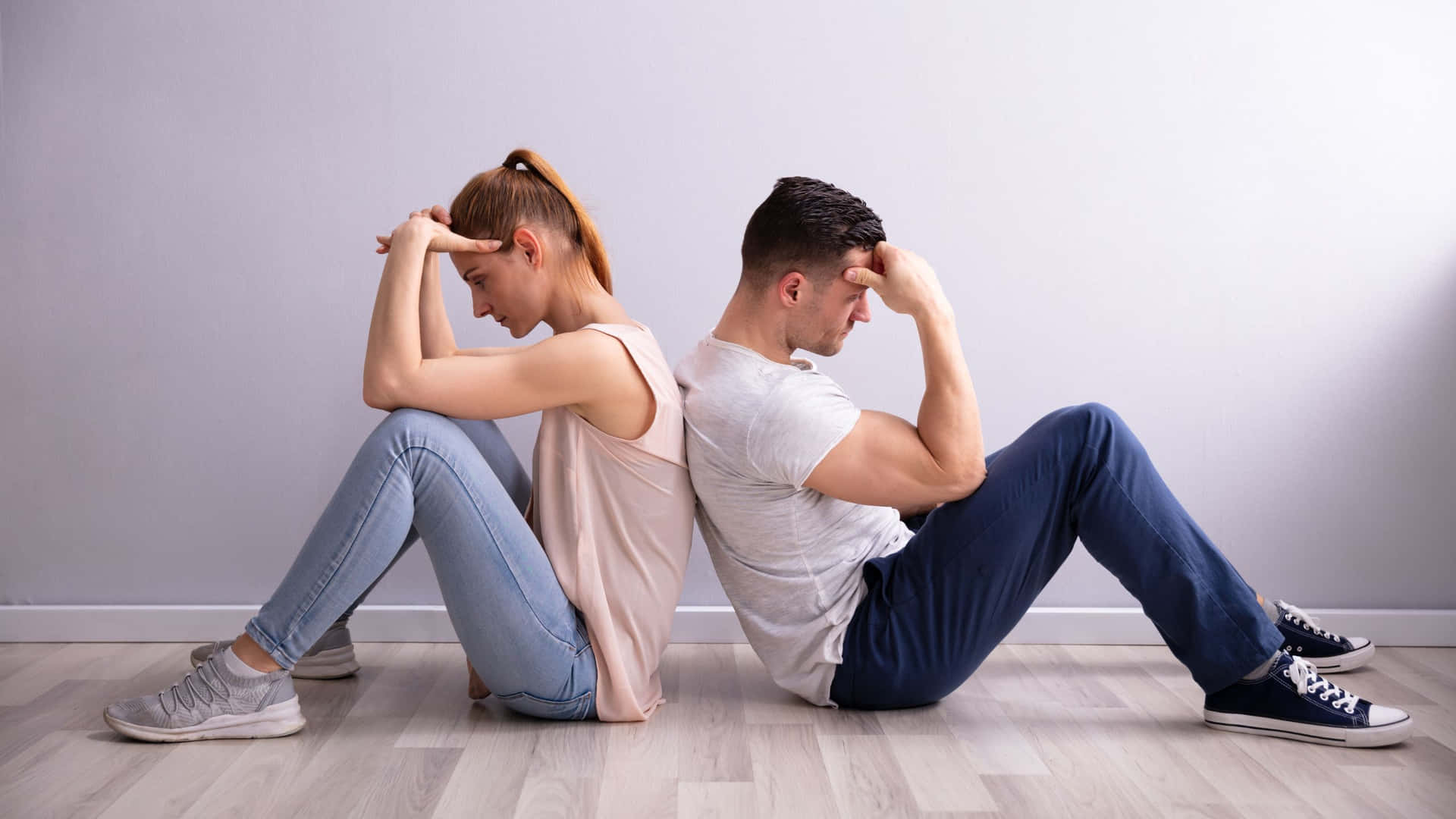 Sad Couple Leaning On Each Other Wallpaper