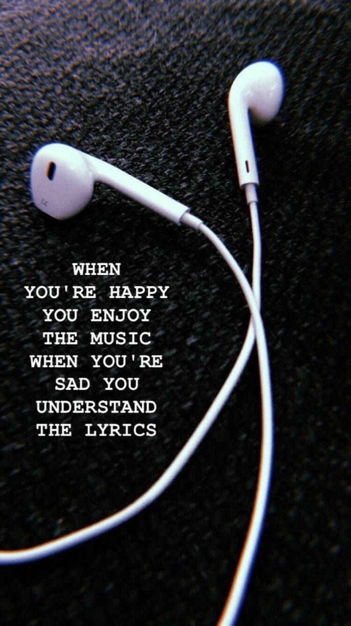 Earphones With The Quote When You're Happy The Music Is When You Understand The Lyrics Wallpaper