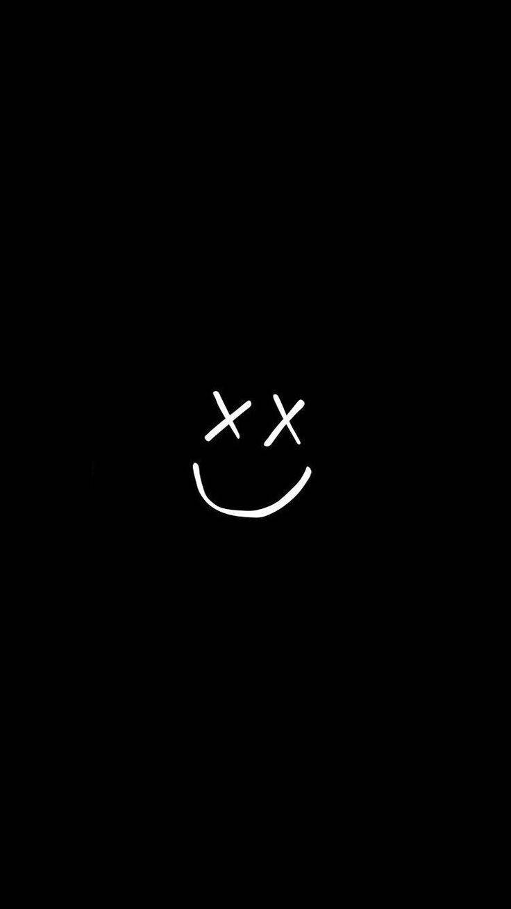 A Black Background With A White Smiley Face Wallpaper