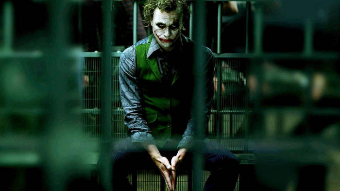 Sad Joker Behind Bars Wallpaper