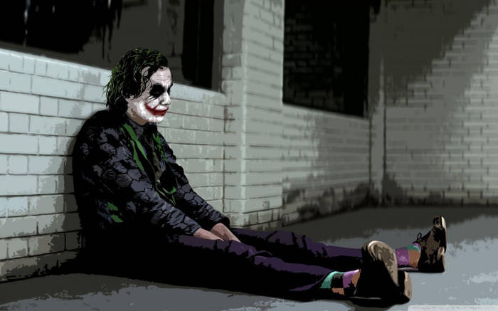 Joker Triste Si Siede Contro Il Muro Sfondo