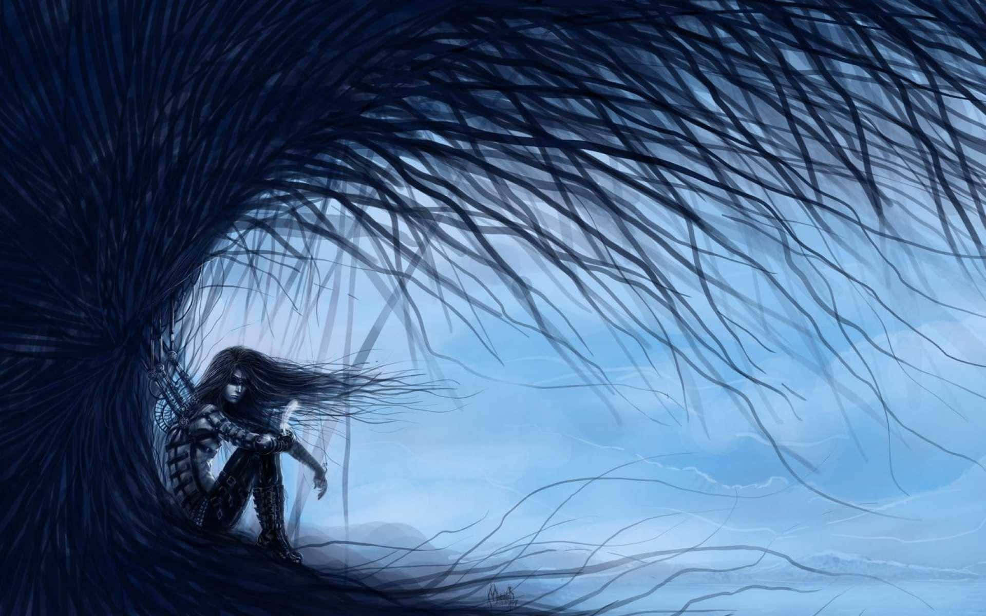 En kvinde sidder i et mørkt hule med langt hår, der blæser i vinden Wallpaper