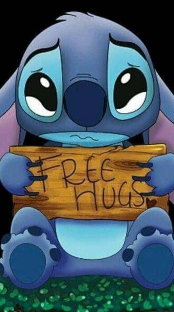 A Stitch Holding A Sign That Says Free Hugs Wallpaper