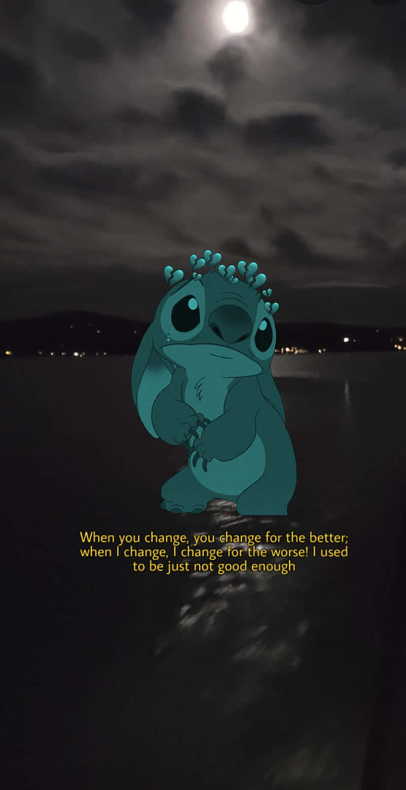 "Sad Stitch, a character from Lilo&Stitch, stands alone on the beach" Wallpaper