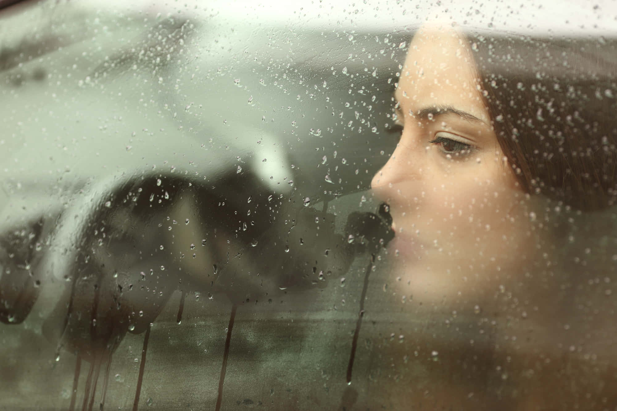 Sadness Girl On Car Window With Raindrops Picture