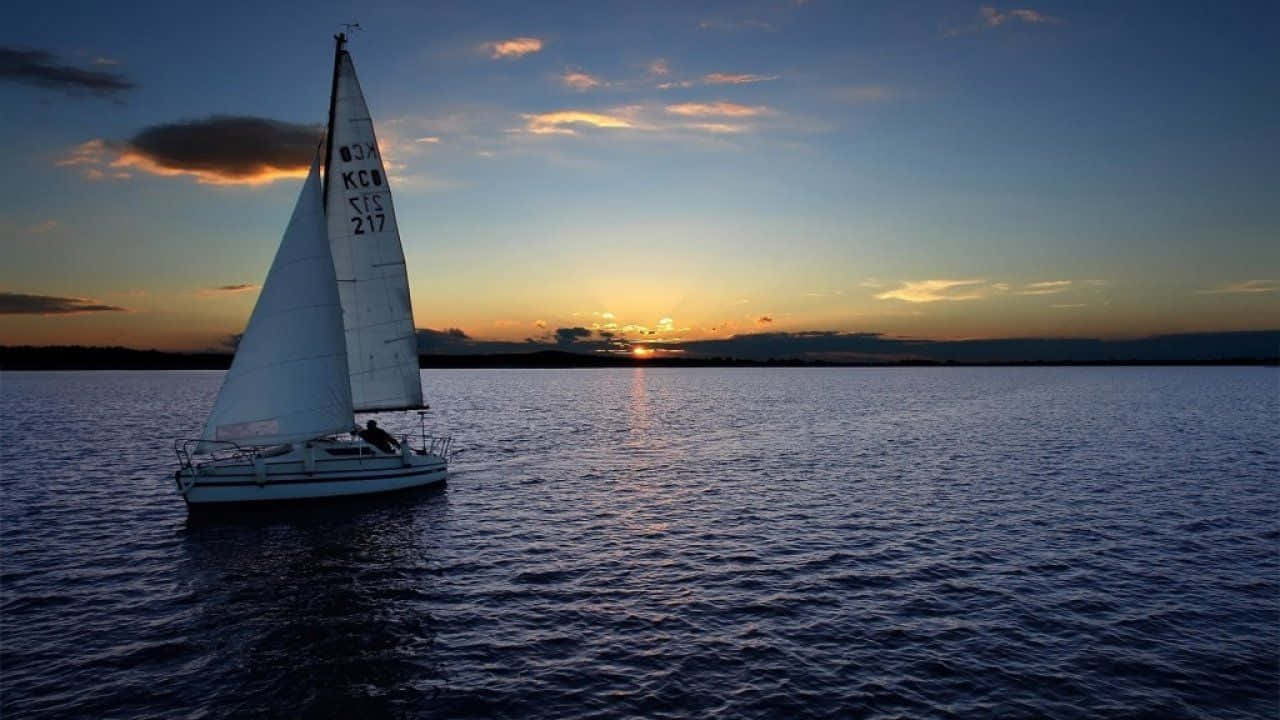 An idyllic sailboat floating on a serene ocean