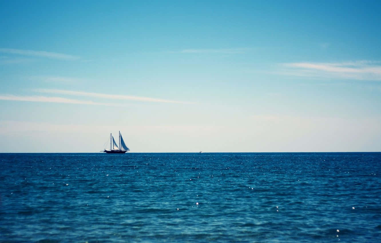 A Sailboat Drifting Gently in the Sea