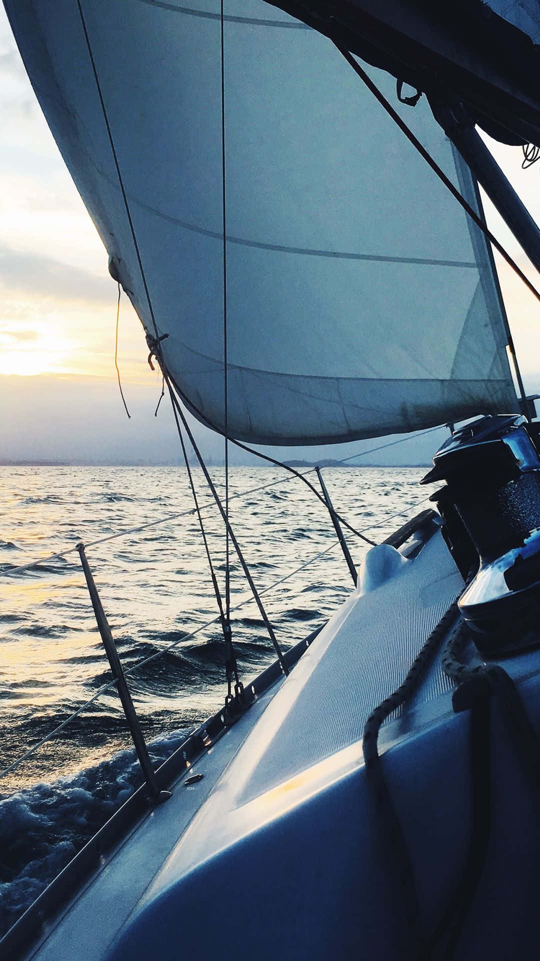 Image  A beautiful sailboat sailing into the sunset