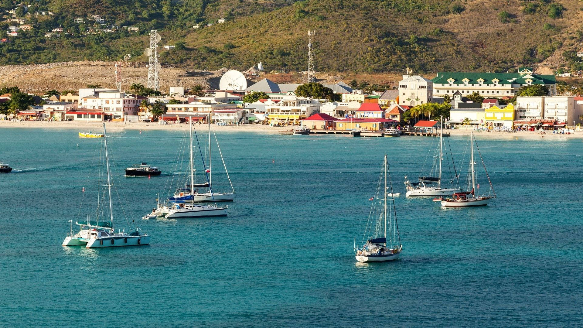 Sailboats On Sint Maarten's Calm Waters Wallpaper