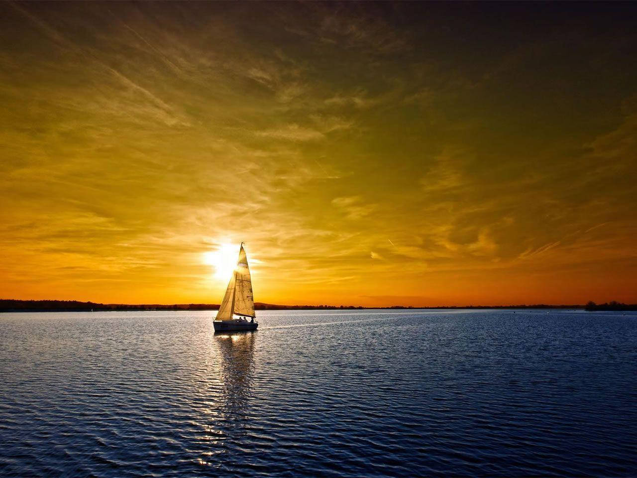 Sailing Boat And Ocean Sunset Wallpaper
