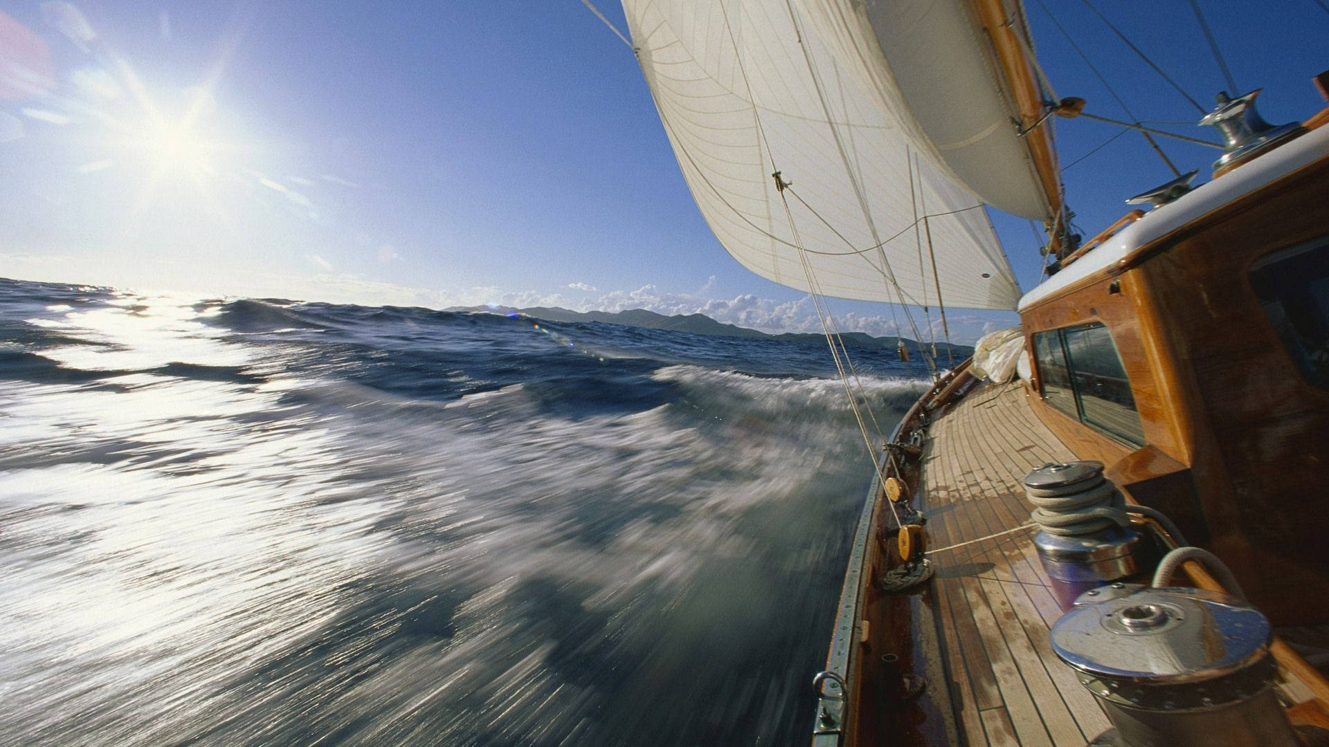 Sailing Quickly On Blue Seas Wallpaper