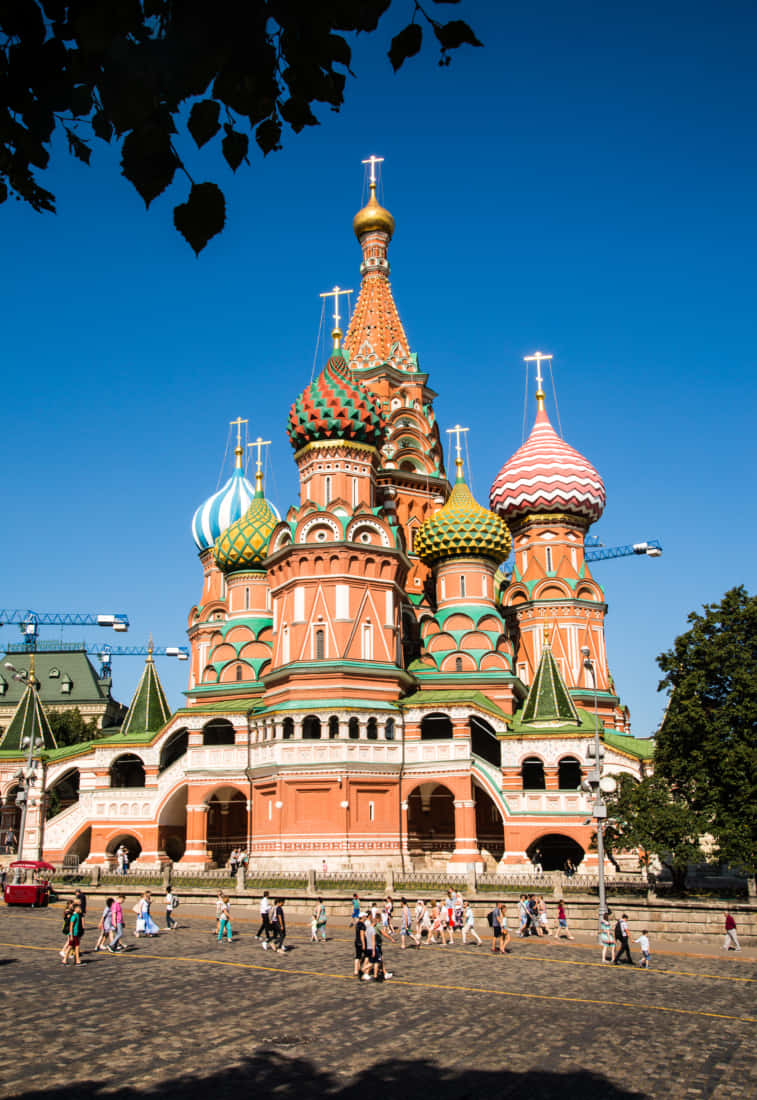 Saint Basil's Cathedral With Cross Spires Atop Bulbous Steeples Wallpaper